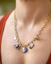 Saltine Cracker Charm, Sardine Can Charm, Instant Ramen Charm, Chocolate Bar Charm and Dirty Martini Charm paired with Gold Endless Clasp Bracelets worn as a a necklace on model.