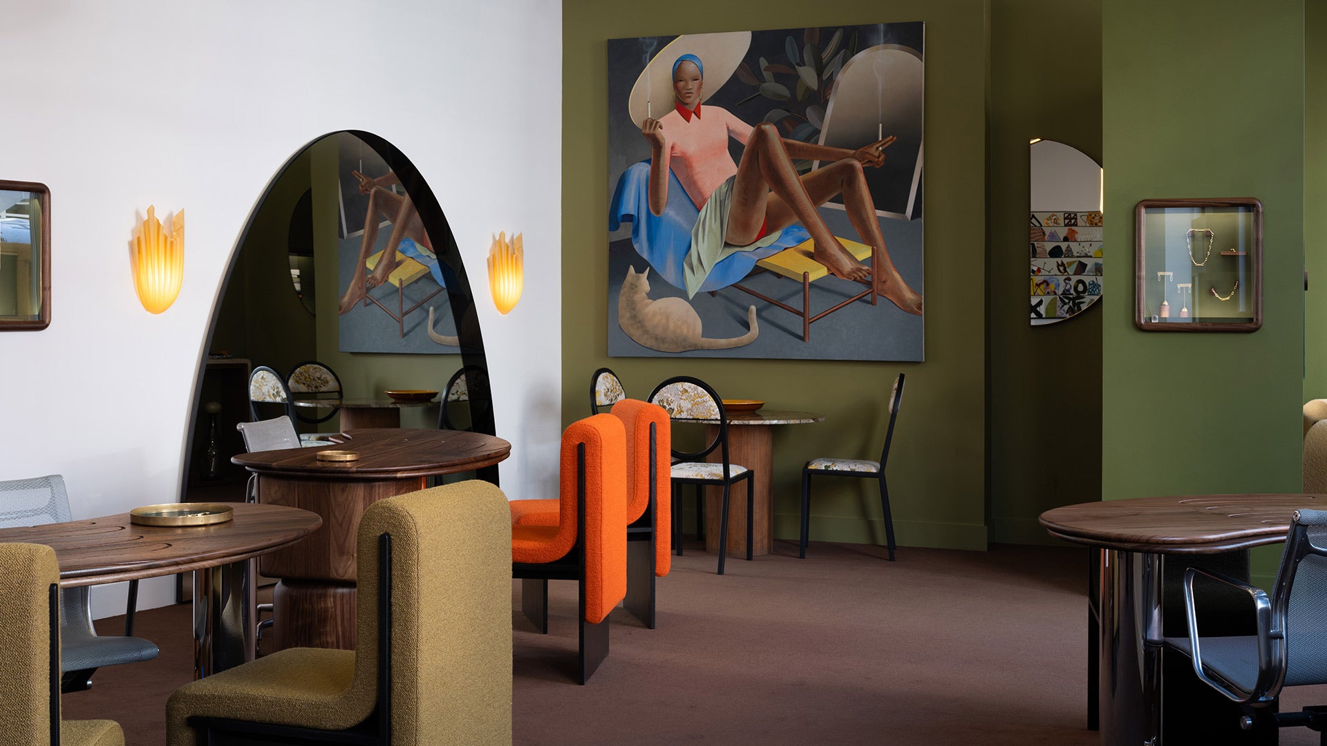 Closeup details of the Mociun Williamsburg Brooklyn Showroom interior, featuring a suite of Bower Studios  furnishings including Melt Accent Chairs ®, Wide Archway Mirror and Half Circle Mirror, alongside  bespoke walnut desks created in collaboration with Caitlin Mociun, as well as a large scale portrait painting by Robin F. Williams.