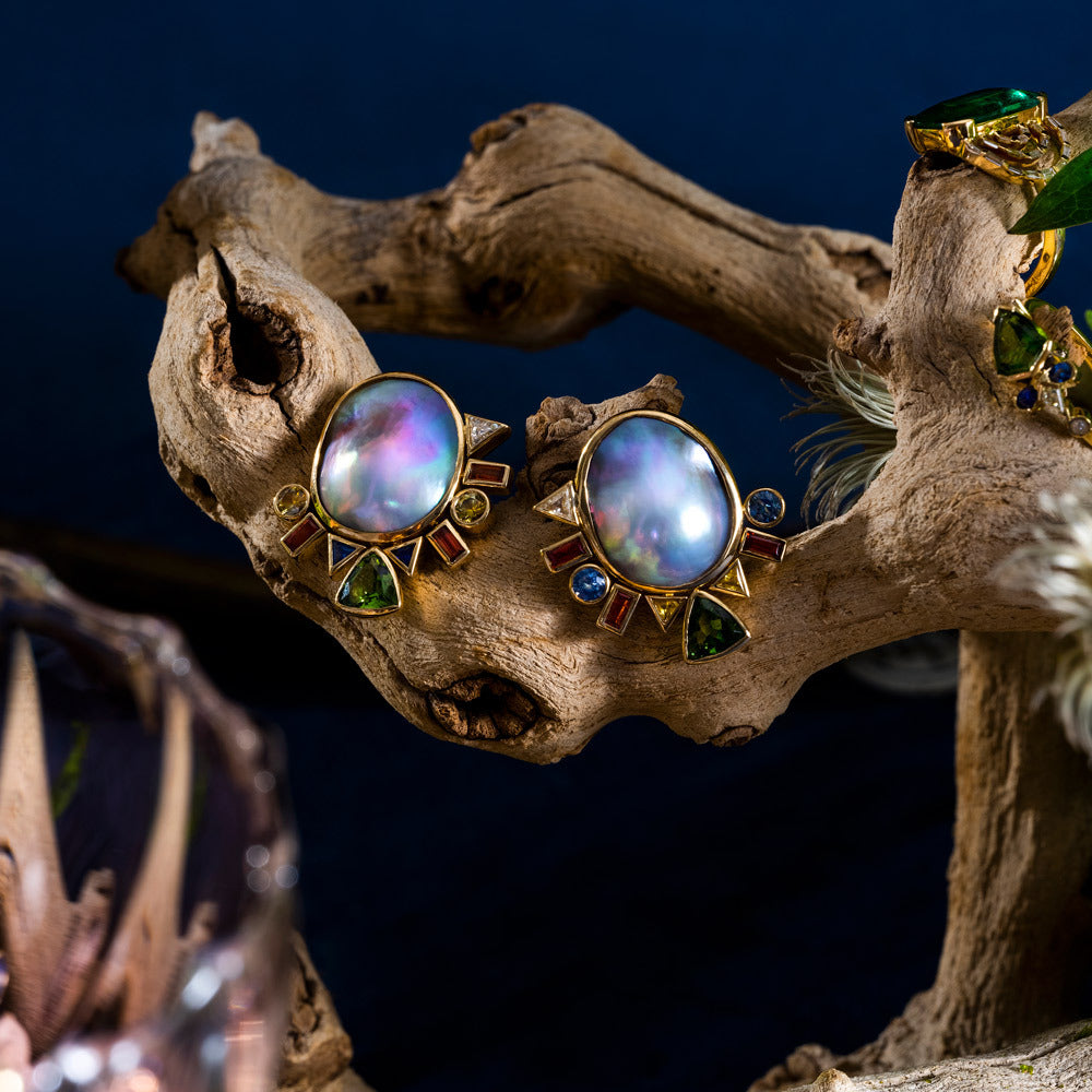 product_details::Styled image featuring the Cosmic Realm Earrings.