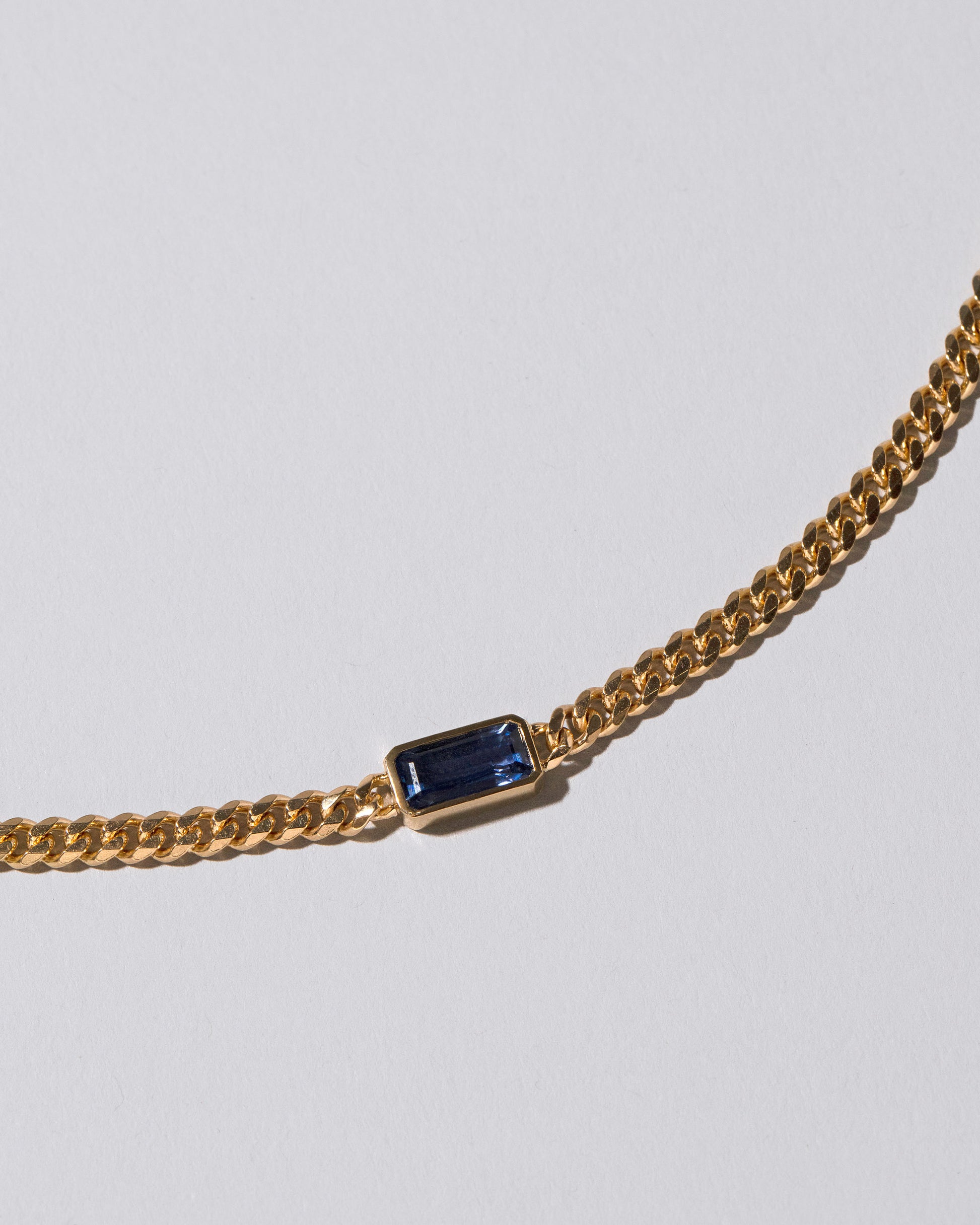 Closeup details of the Serenity Necklace on light color background.