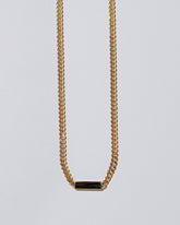 Closeup details of the Generosity Necklace on light color background.