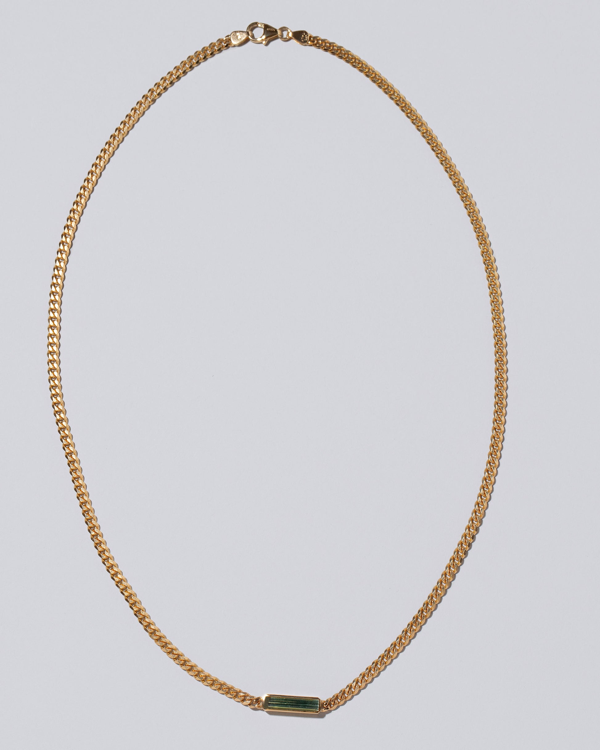 Lucid Thinking Necklace on light color background.