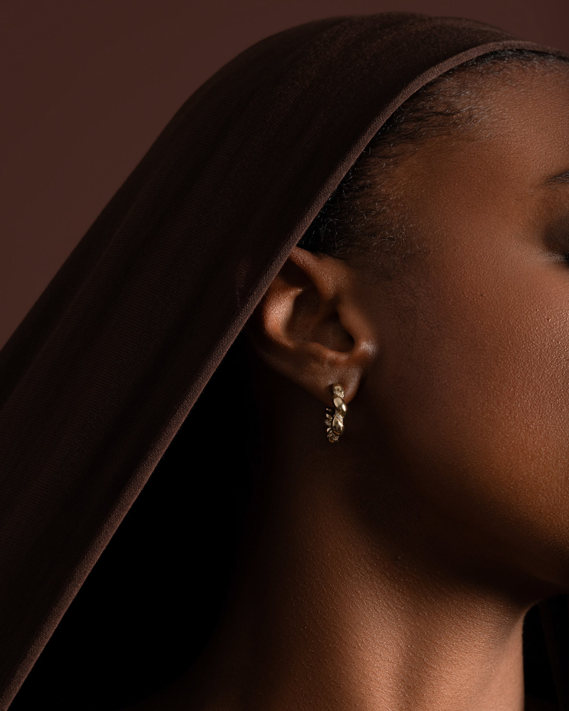 Gold Wrapped Hoop Earrings on model.
