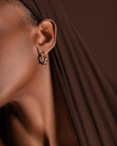 Styled image featuring the Gold Wrapped Hoop Earrings.