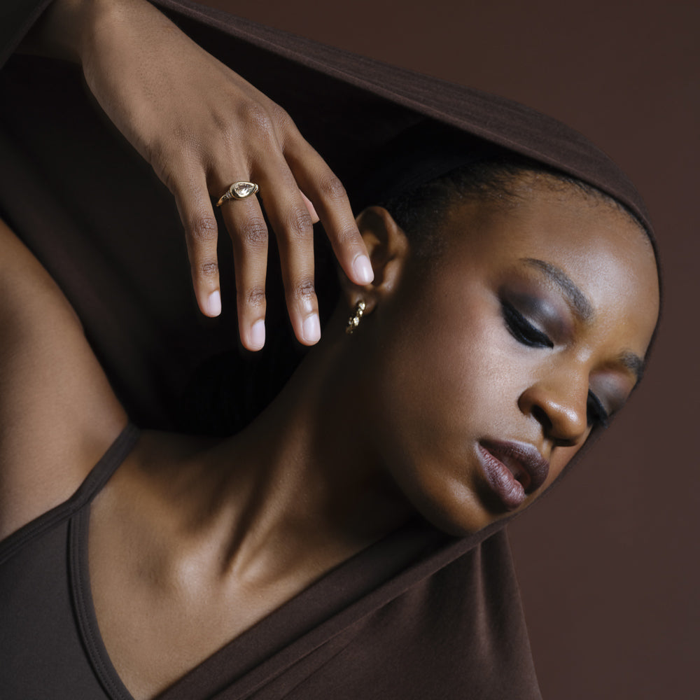 product_details::Gold Wrapped Hoop Earrings and Bind Ring on model.