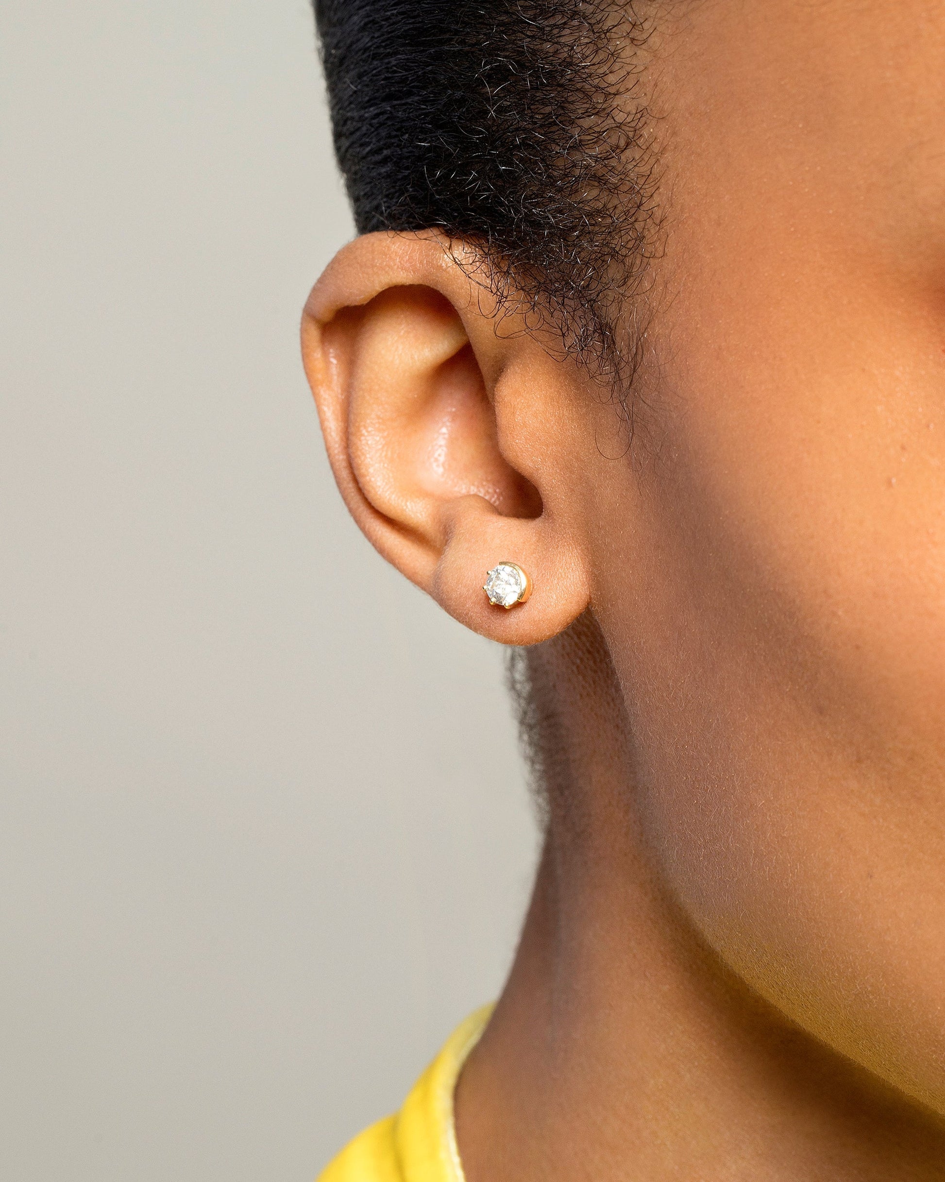 Diamond Sun & Moon Stud Earrings on model.