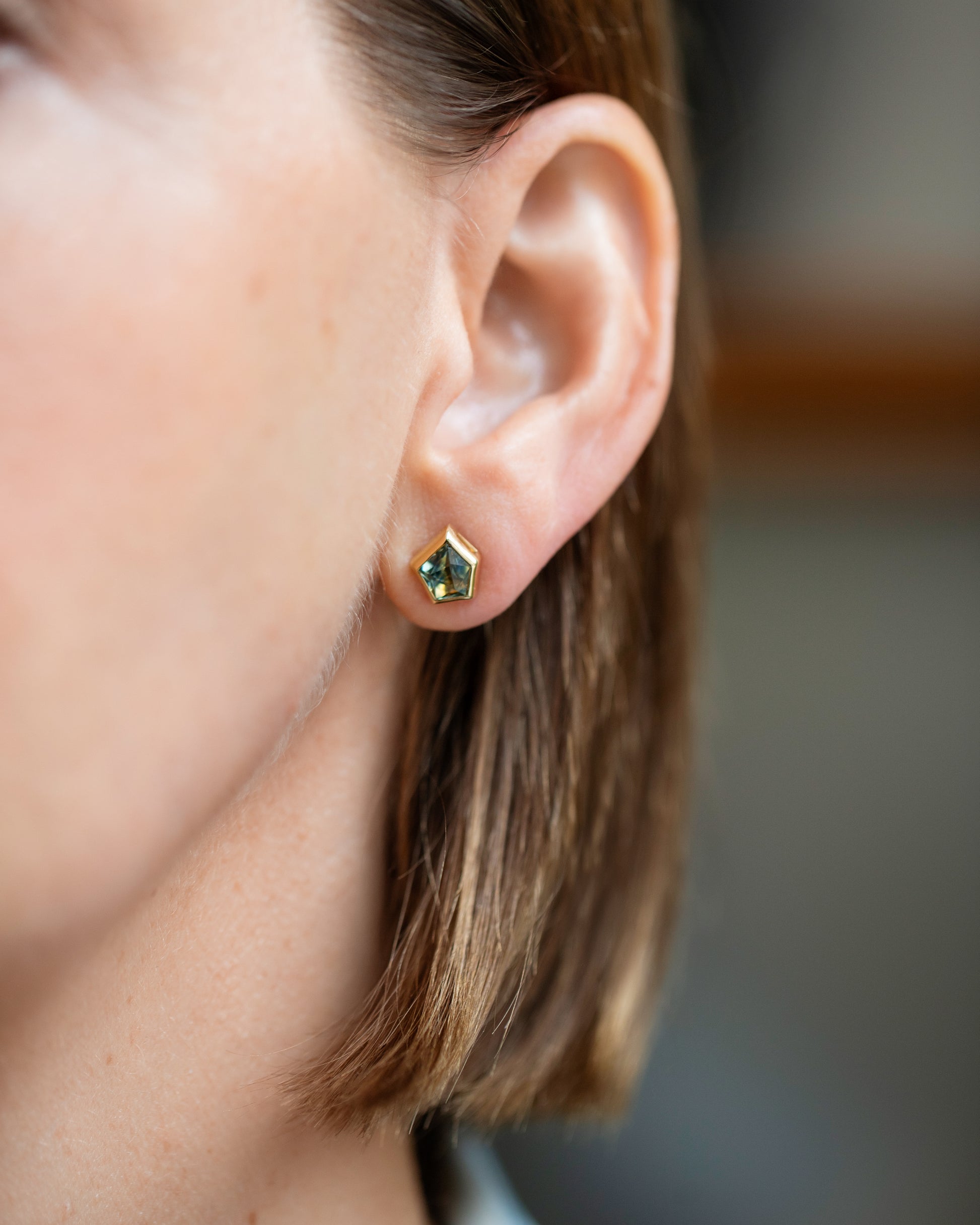 Teal Bicolor Sapphire Geyser Stud Earrings on model.
