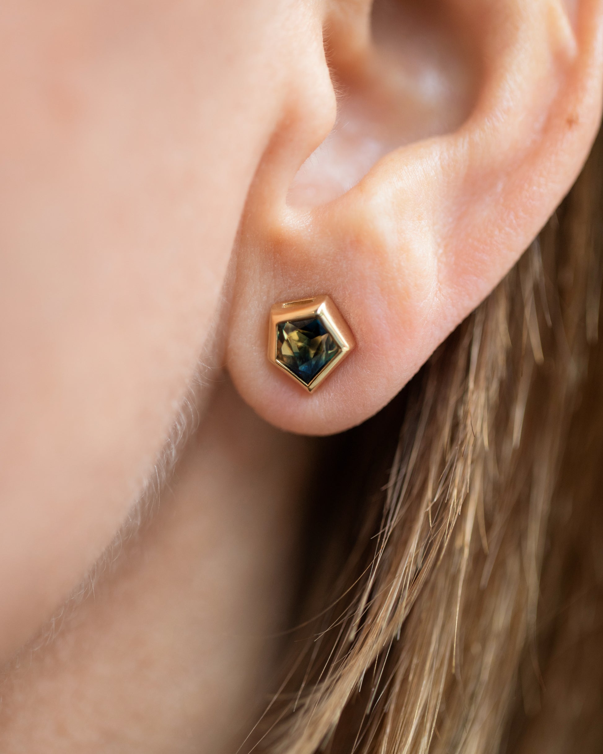 Green Bicolor Sapphire Geyser Stud Earrings on model.