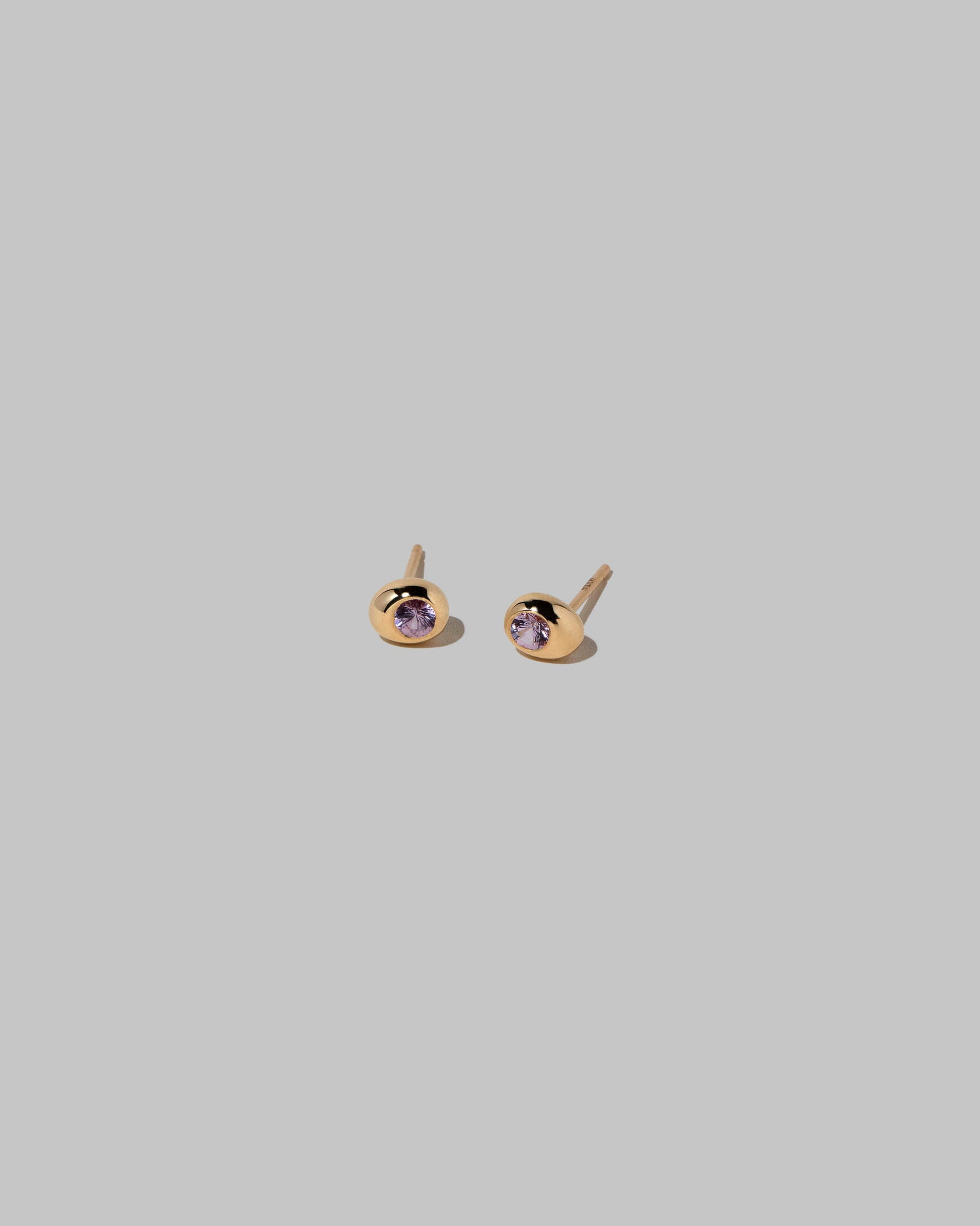 Pink Spinel Level Stud Earrings on light color background.