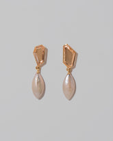 Tricopilia Earrings on light color background.