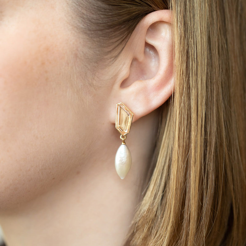 product_details::Tricopilia Earrings on model.