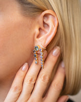 Passiflora Earrings on model.