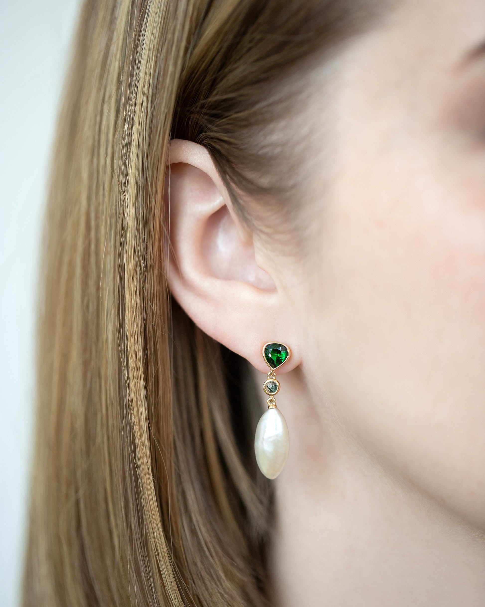 Convallaria Earrings on model.