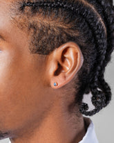 Sapphire Sun & Moon Stud Earrings on male model.