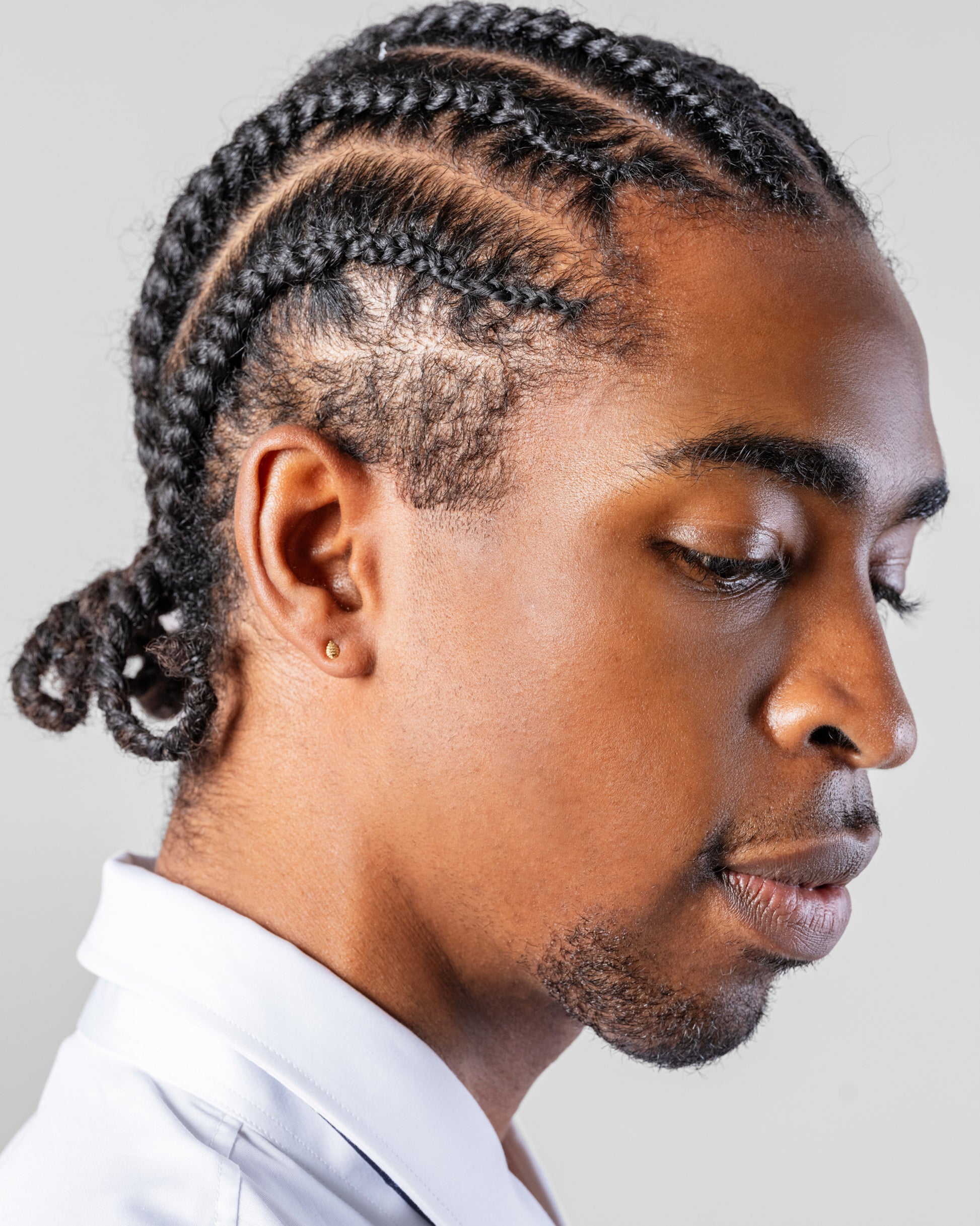 Tear Stud Earring Single on male model.