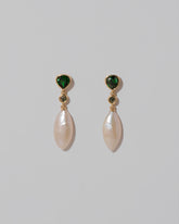 Convallaria Earrings on light color background.