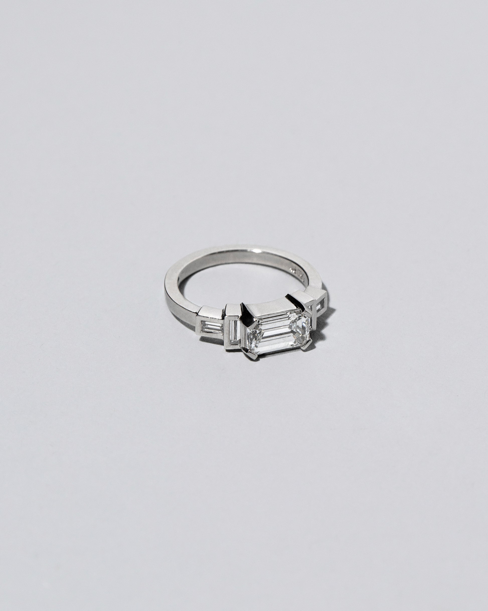 Platinum Diamond Expression Ring on light color background. Please note: This image represents a custom creation.