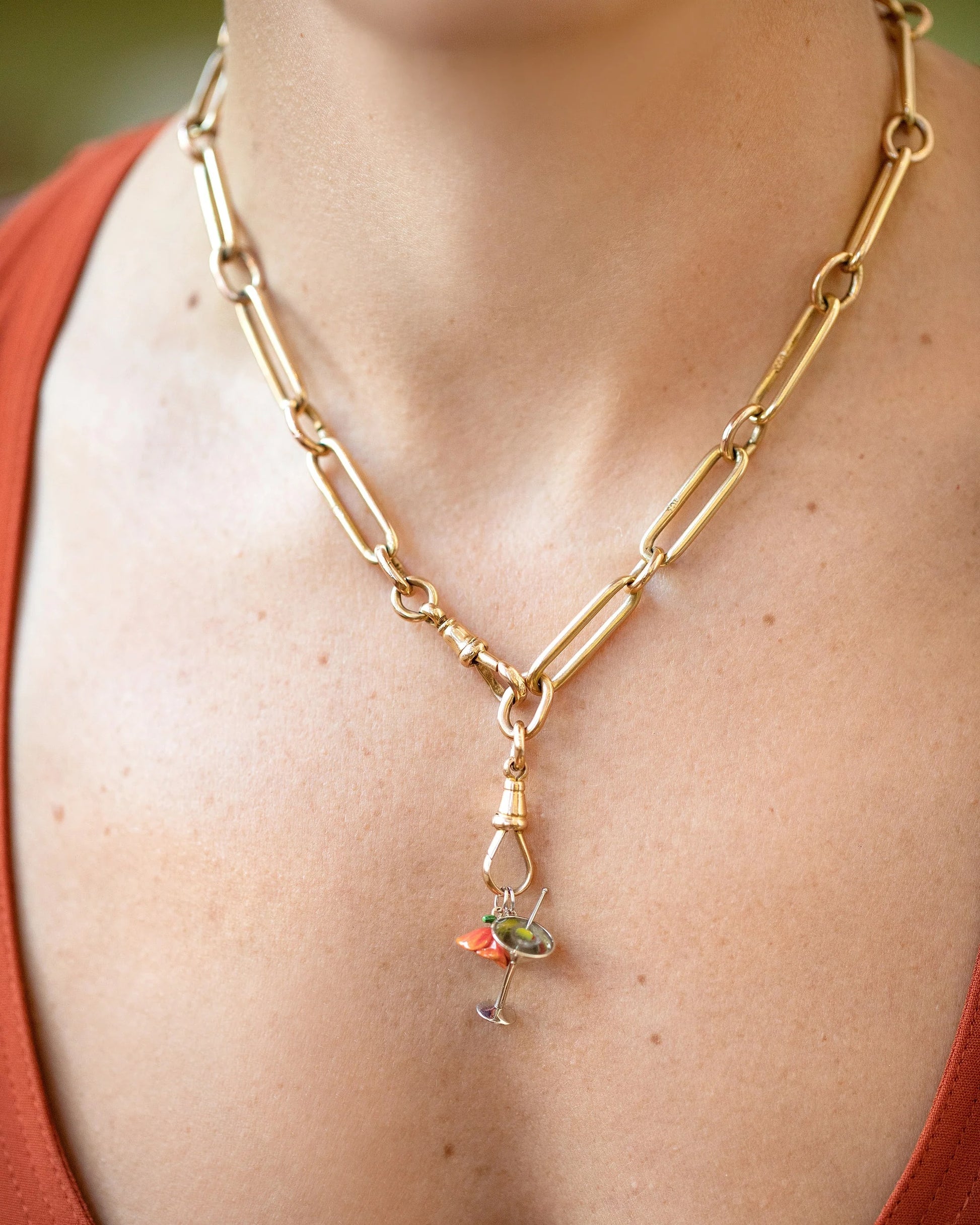 California Poppy Charm, Dirty Martini Charm and Luna Ring Charm paired with the Grand Swivel Fob and Solid Link Necklace on model.