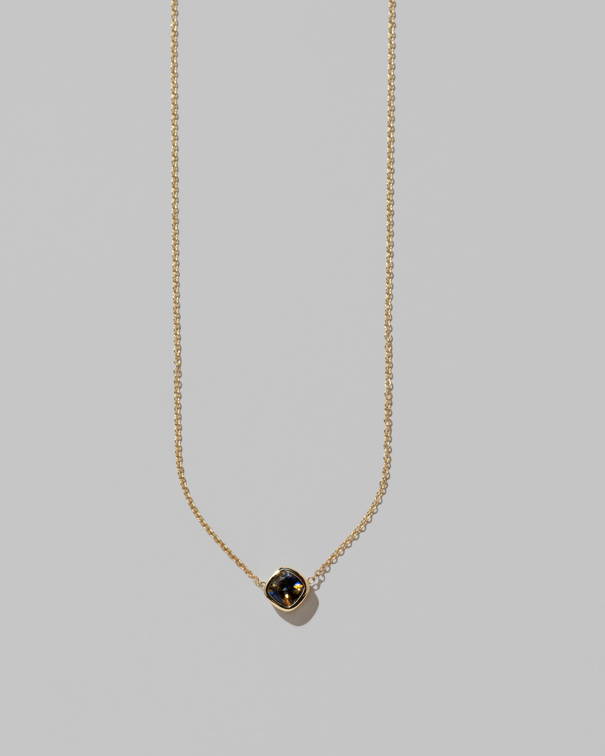 Closeup details of the Northern Lights Necklace 007 on light color background.