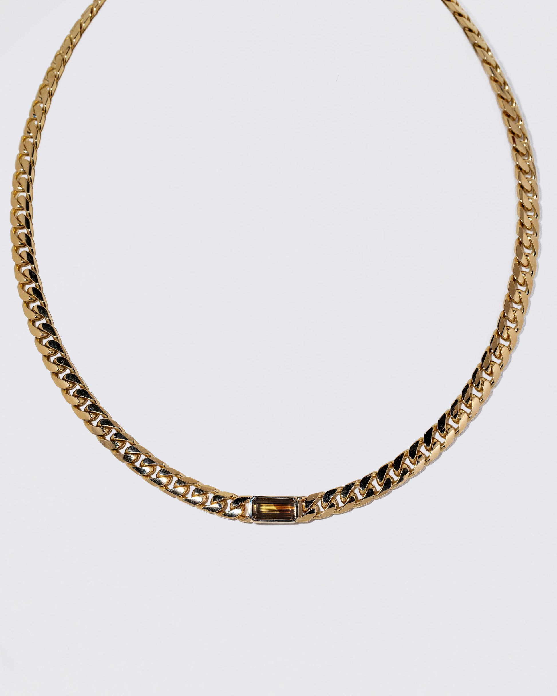 Identity Chain Chrysoberyl Necklace 001 on light color background.