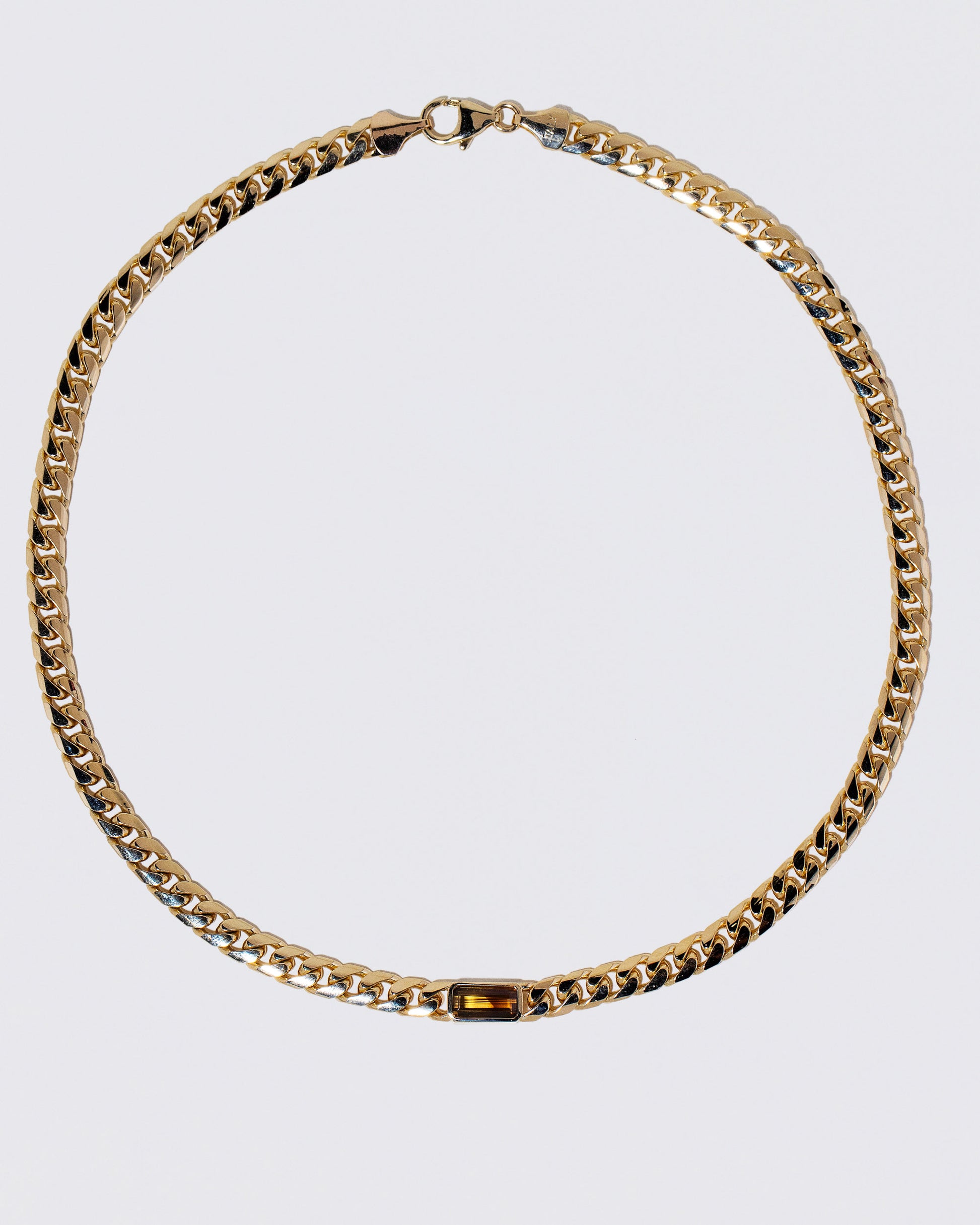 Identity Chain Chrysoberyl Necklace 001 on light color background.