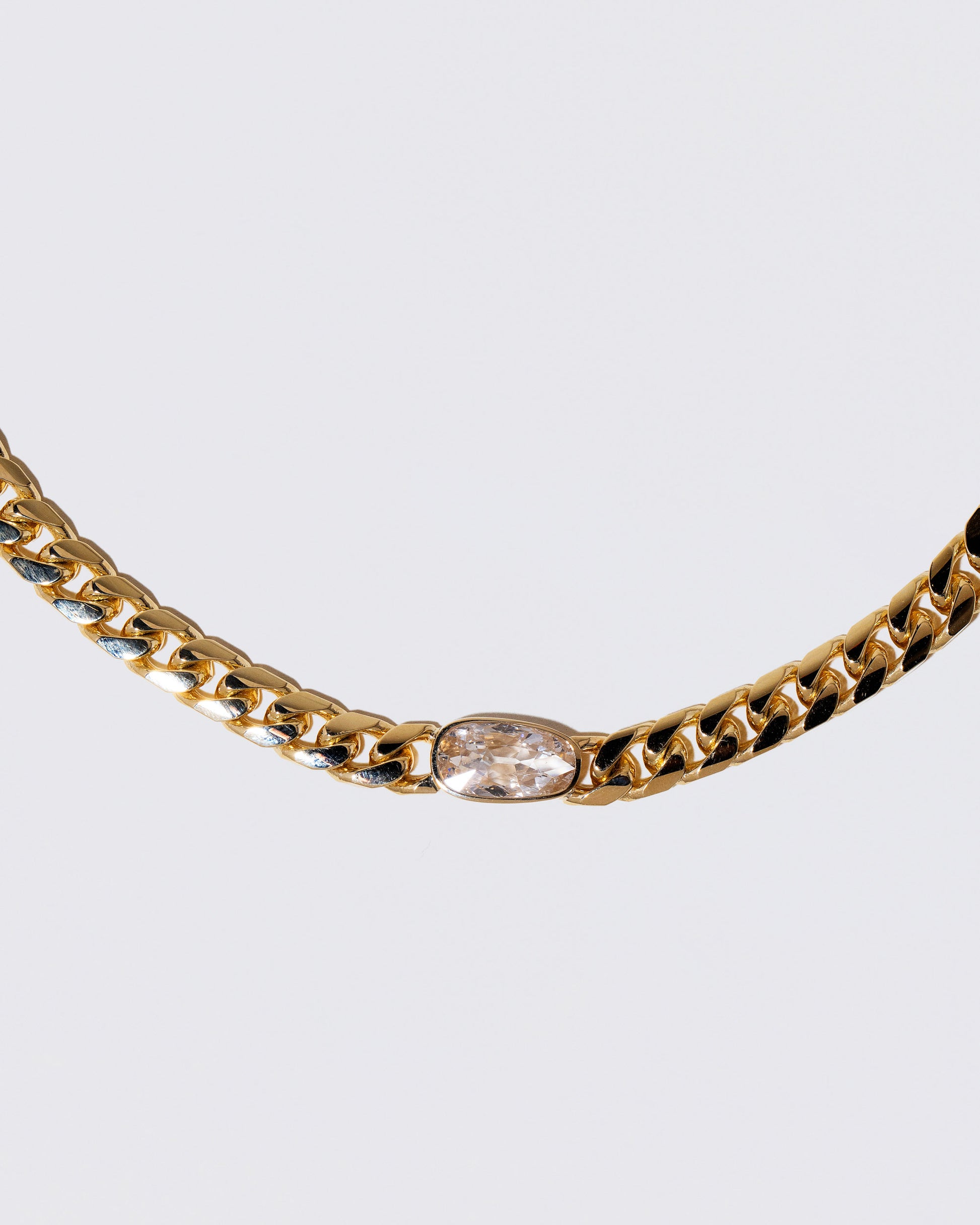 Closeup details of the Identity Chain Diamond Necklace 001 on light color background.