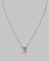 Closeup details of the Poseidon Necklace on light color background.