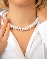 Snow Cap Pearl Necklace on model.