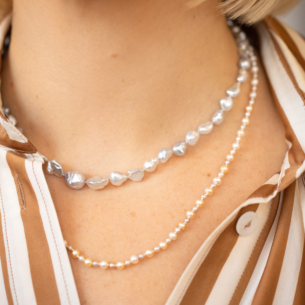 product_details::Ula Pearl Necklace 007 and Ula Pearl Necklace 001 on model.