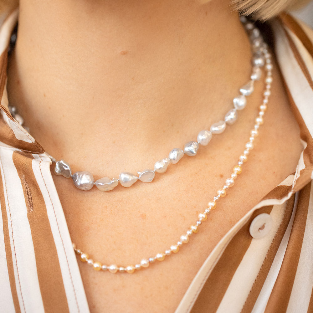 product_details::Ula Pearl Necklace 001 and Ula Pearl Necklace 005 on model.
