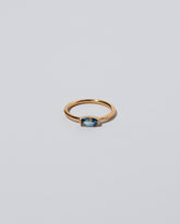 Blue Devant Ring on light color background.