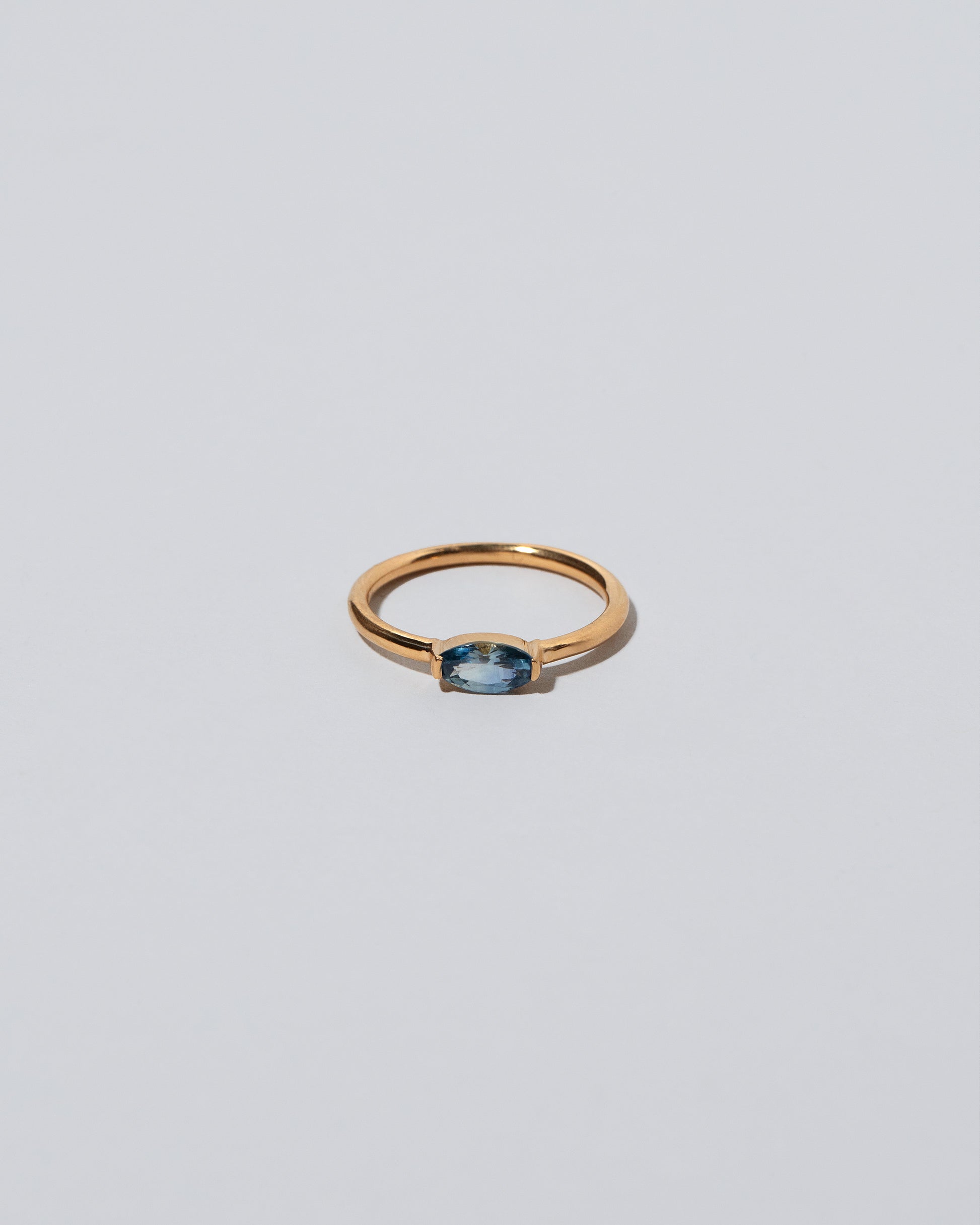Blue Devant Ring on light color background.