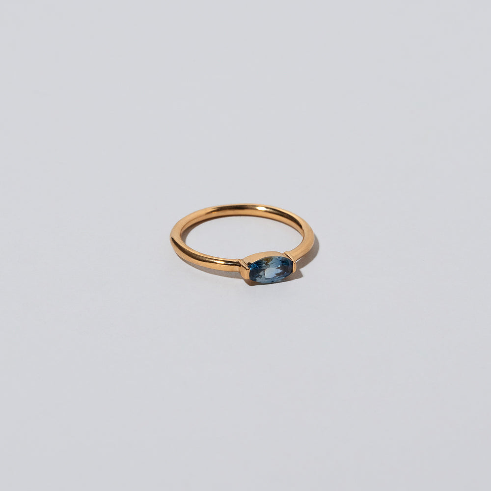 product_details::Closeup details of the Blue Devant Ring on light color background.