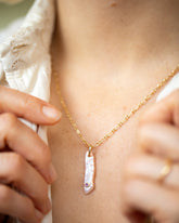 February Birthstone Pearl Pendant With Amethyst and Hot Dog Chain Necklace on model.