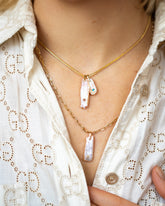 July Birthstone Pearl Pendant With Ruby, December Birthstone Pearl Pendant With Turquoise and 2mm Ritual Chain Necklace layered with the August Birthstone Pearl Pendant With Peridot and 3mm Beveled Oval Chain Necklace on model.