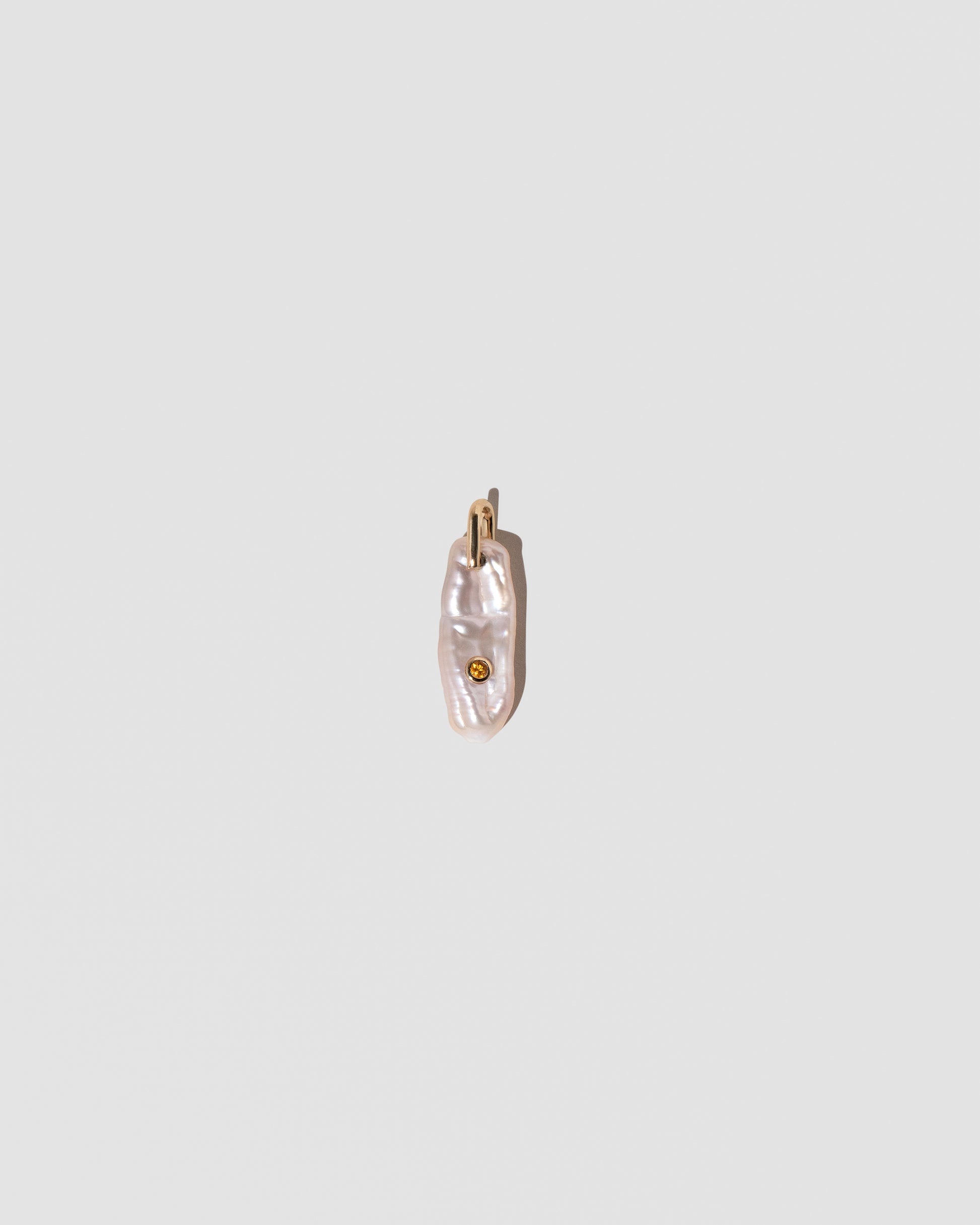 November Birthstone Pearl Pendant With Citrine on light color background.