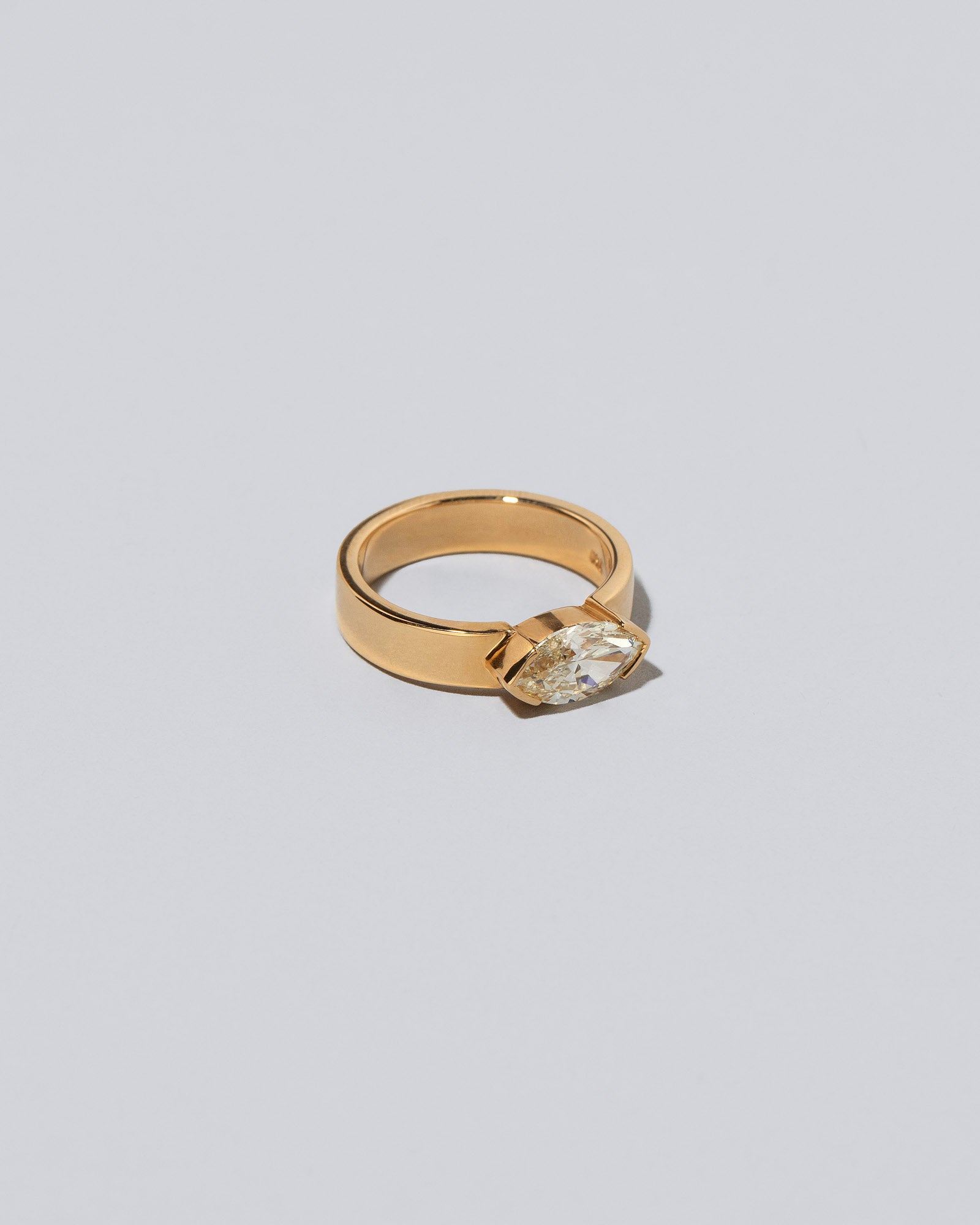 View from the side of the Positivism Ring on light color background.