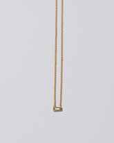 Purity Necklace on light color background.