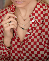 Lover's Kiss Necklace, Purity Necklace, Generosity Necklace and Illusion of Opposites Ring on model.