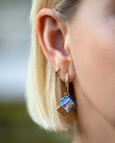 Instant Ramen Charm paired with Solid Tiny Loop Hoop Earrings and styled with the Sardine Fish Charm paired with the Huggie Gold Solid Snack Hoop Earrings on model.