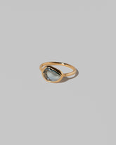 View from the side of the Gusher Bicolor Sapphire Ring 024 on light color background.