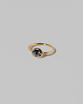 View from the side of the Gusher Blue Sapphire Ring 022 on light color background.