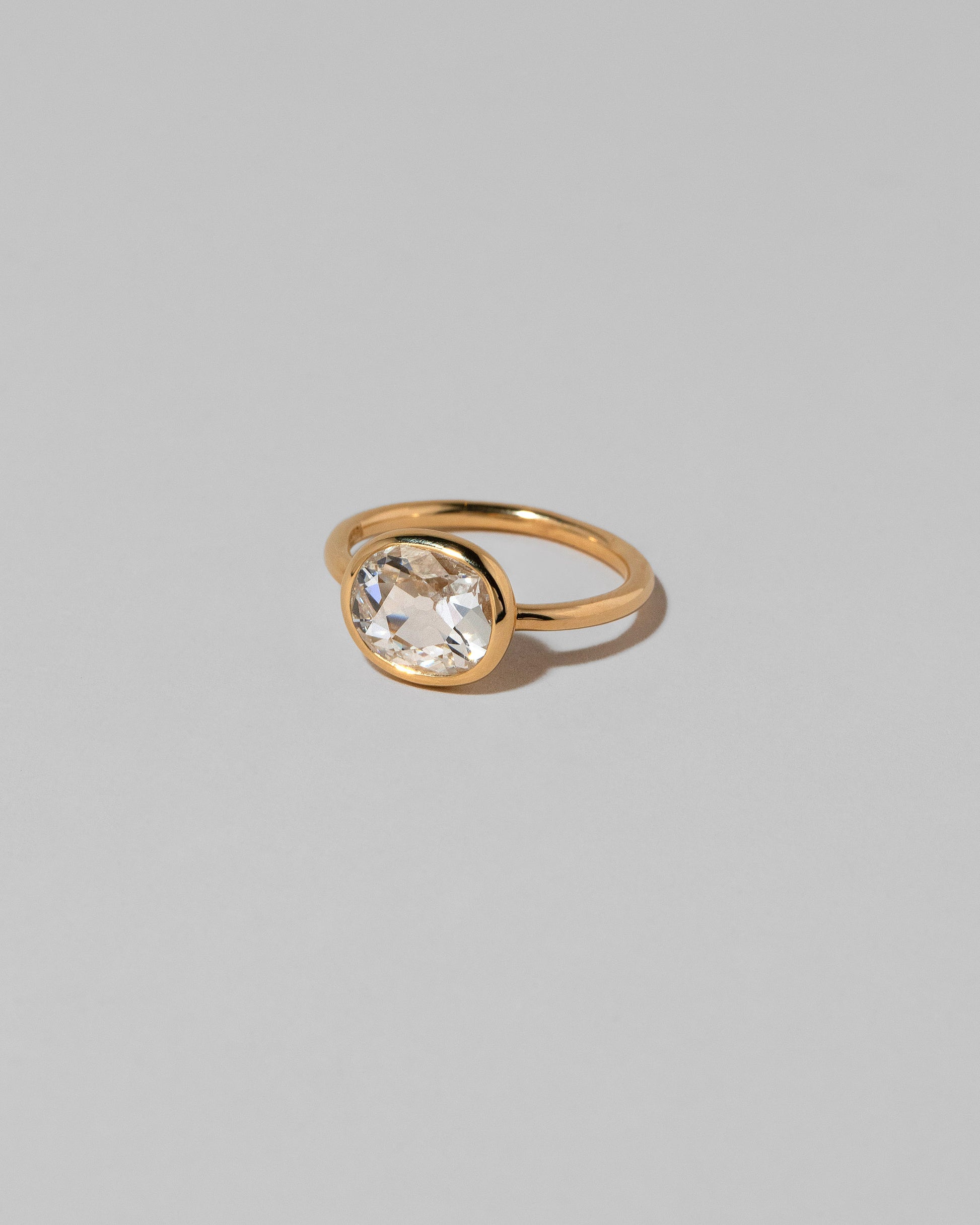 View from the side of the Gusher Diamond Ring 031 on light color background.