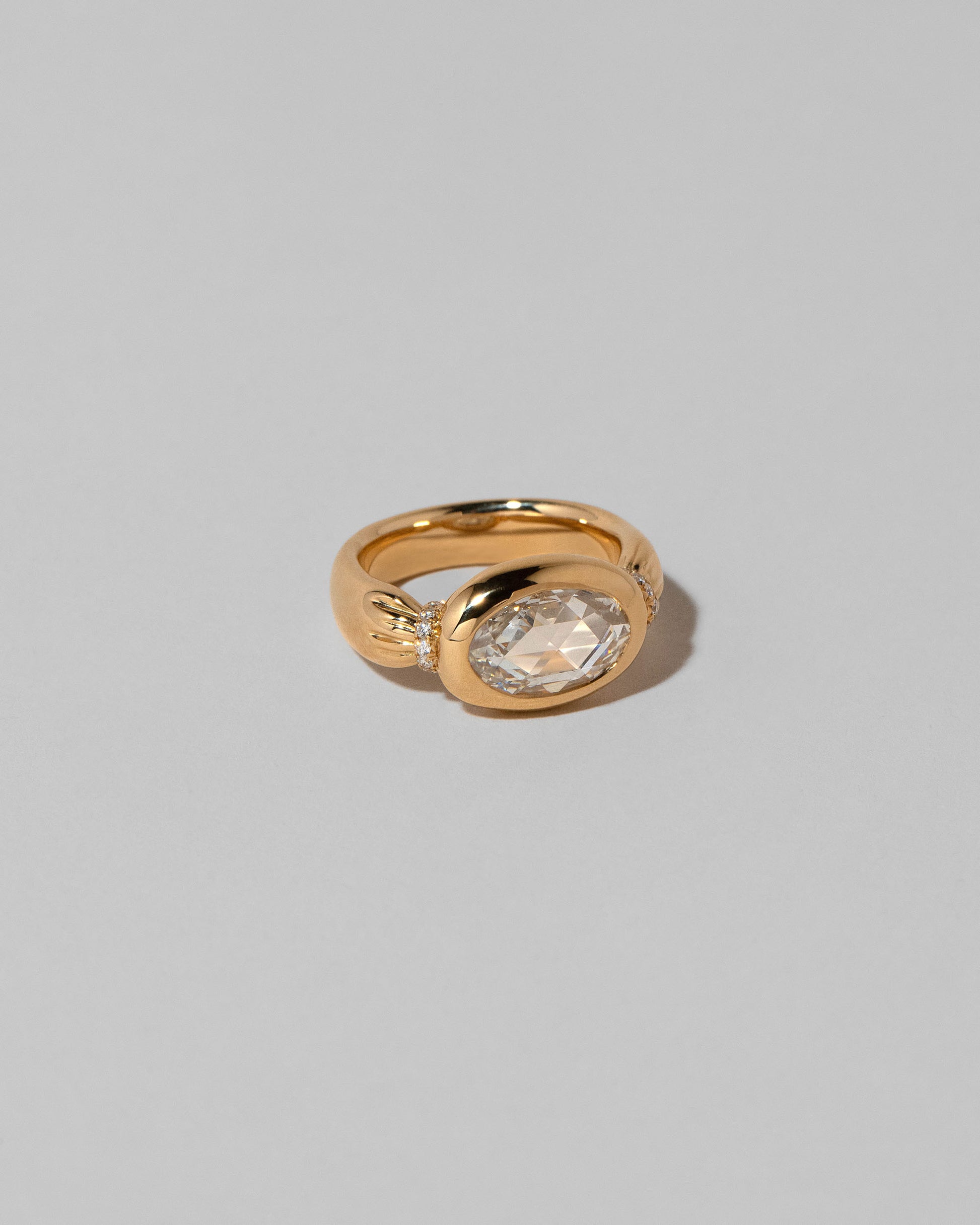 View from the side of the Contort Ring on light color background.