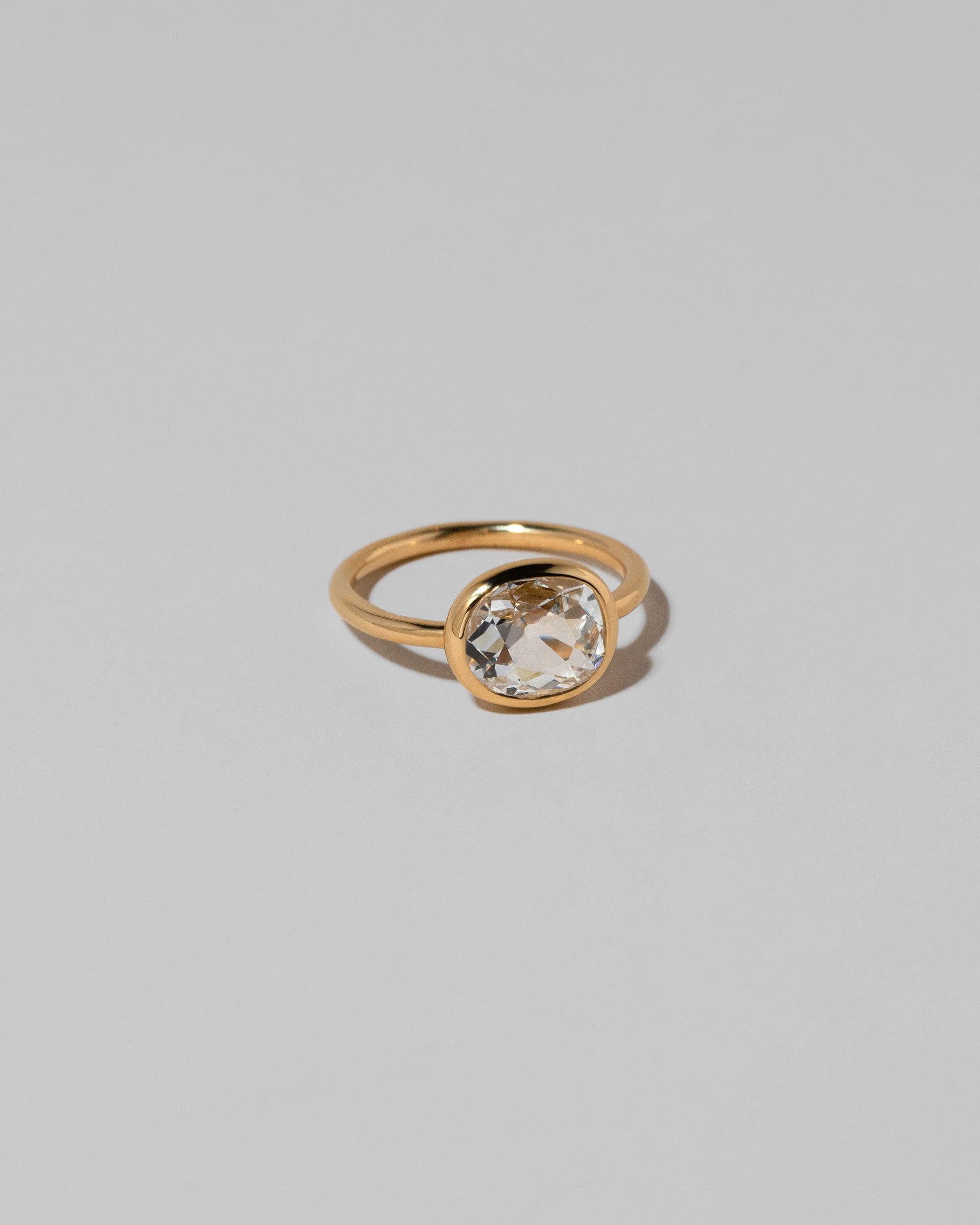 View from the side of the Gusher Diamond Ring 031 on light color background.