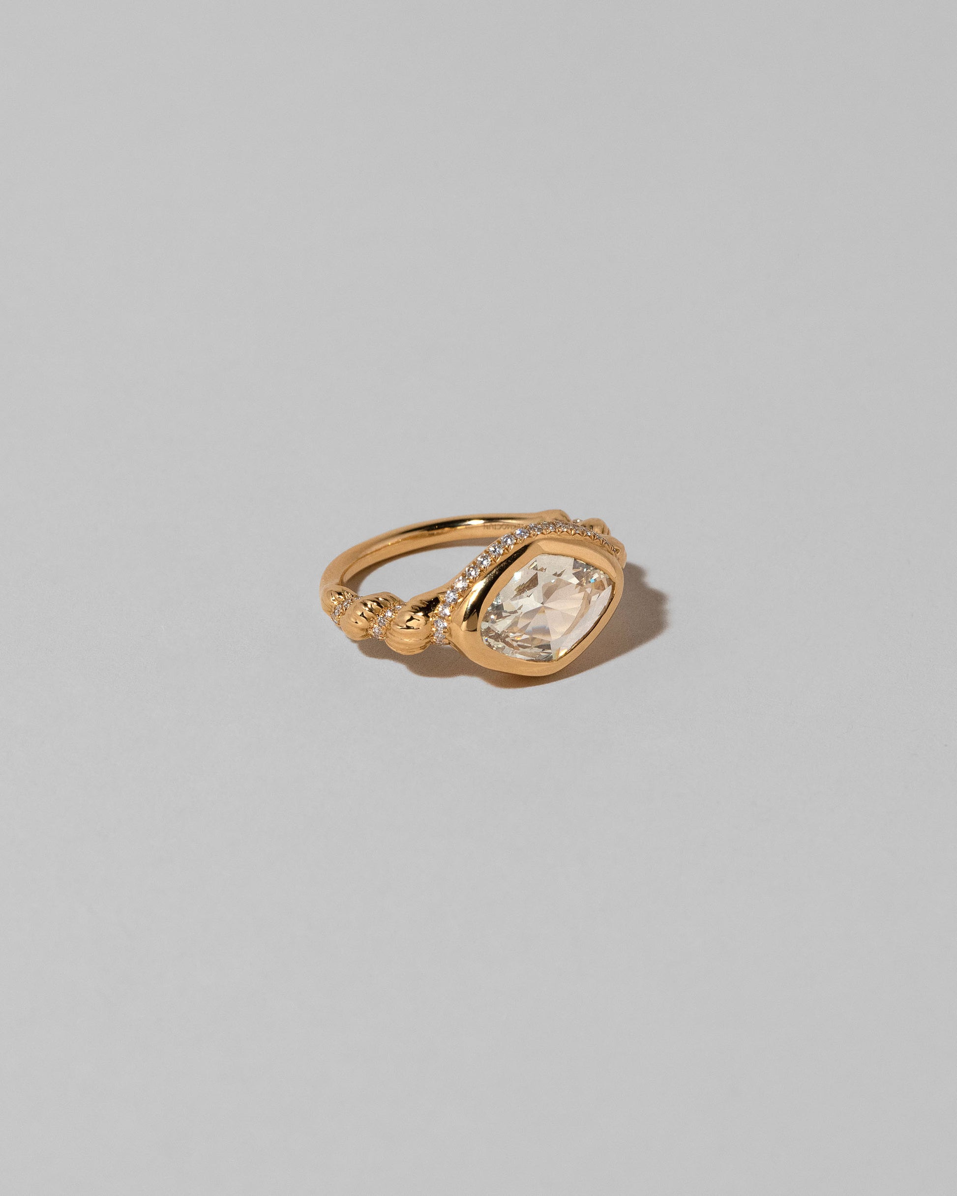 View from the side of the Twist Ring on light color background.