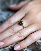 Teal Sapphire Wellspring Ring on model.