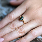 product_details::Teal Sapphire Wellspring Ring on model.