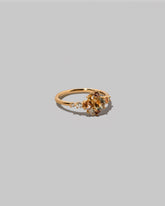 View from the side of the Sapphire Anthea Ring on light color background.