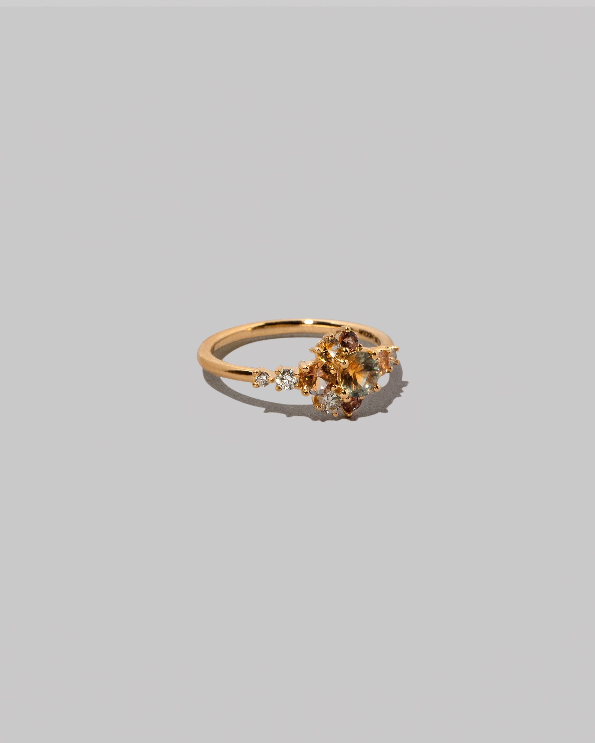 View from the side of the Sapphire Anthea Ring on light color background.